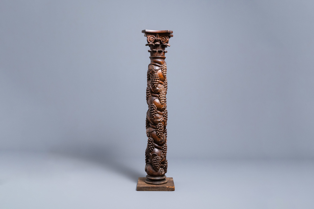 A carved walnut Ionic column with grapevines, 17th C.