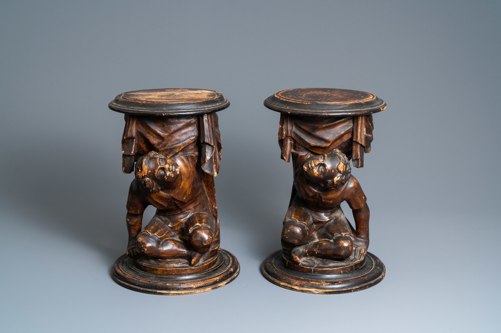 A pair of patinated coniferous wood candle supports in the shape of kneeling Moors, Venice, Italy, 17/18th C.