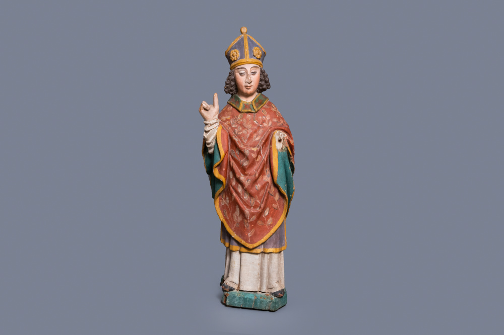A large polychromed oak figure of a bishop, 16th C.