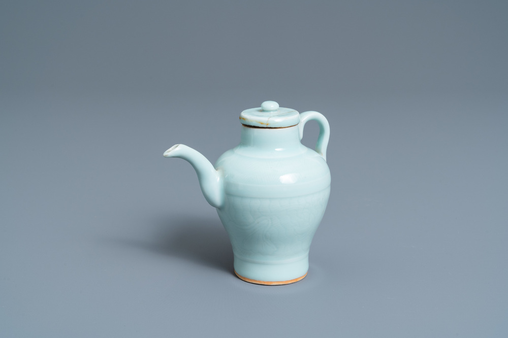 A Chinese monochrome celadon-glazed ewer and cover with incised design, Qianlong