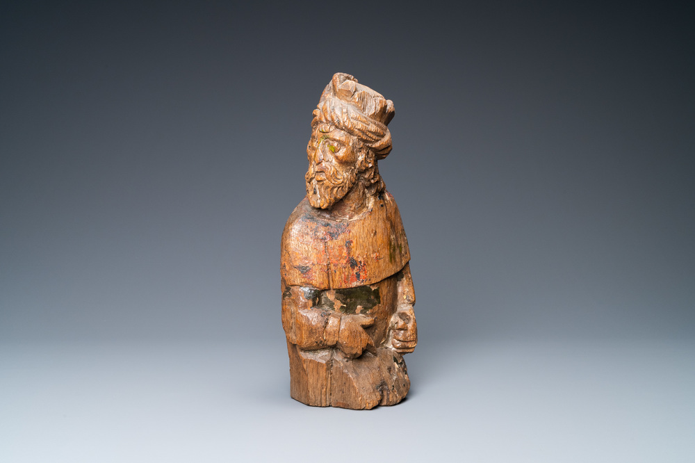An oak figure of a prophet with traces of polychromy, 16th C.