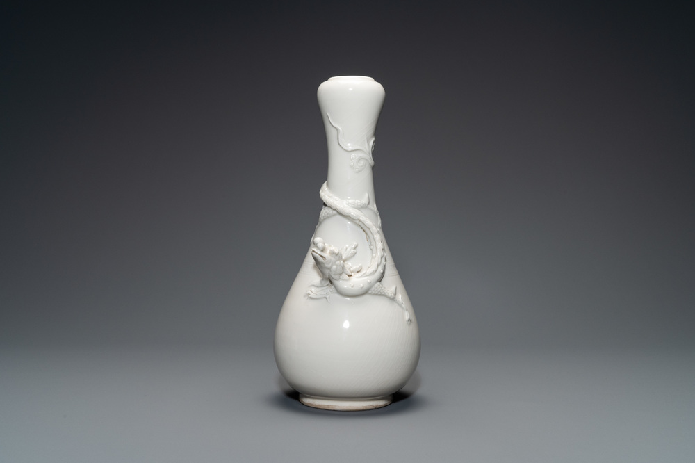 A Chinese Dehua blanc de Chine vase with applied dragon, Kangxi/Yongzheng