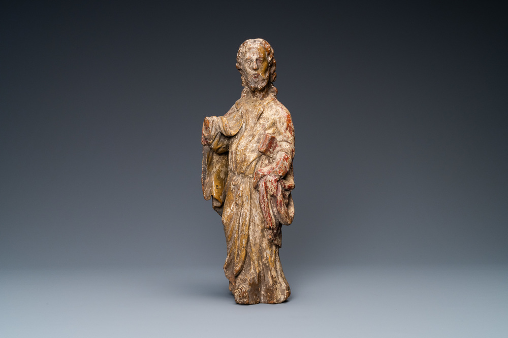 A polychromed wooden figure of an evangelist, 16th C.