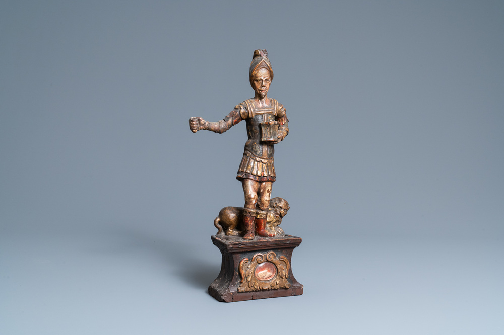 Une statue de Saint Adrien en bois sculpt&eacute; et polychrom&eacute; sur socle reliquaire, 17&egrave;me