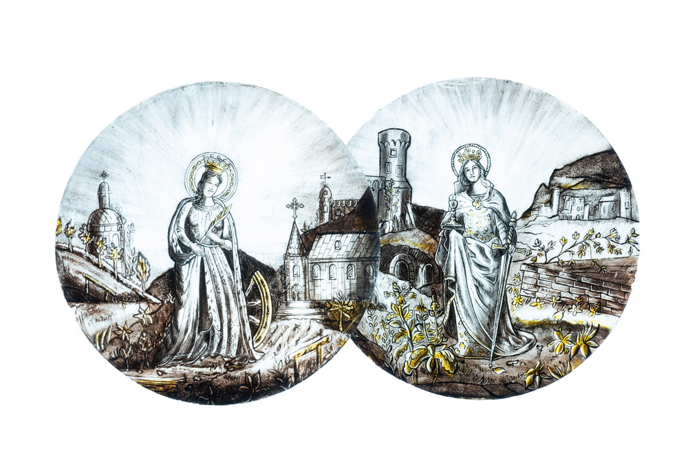 Sign&eacute; Le Pluy, Lille: deux rondels repr&eacute;sentant Sainte Catherine et Sainte Barbe en verre peint en grisaille et jaune d'argent, 19/20&egrave;me