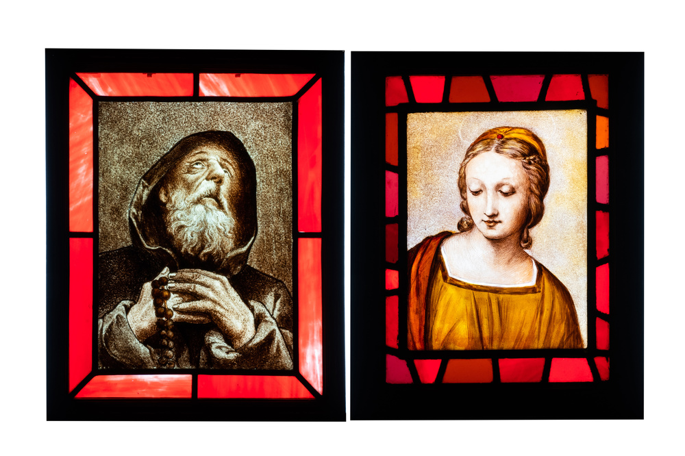 Two composite stained and painted glass windows with a monk and a female bust after Rapha&euml;l, 19th C.