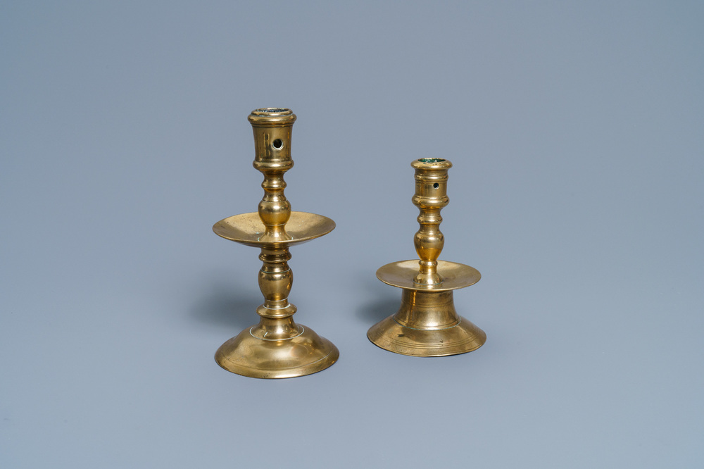 A Flemish bronze capstan candlestick and a disc candlestick, 16/17th C.