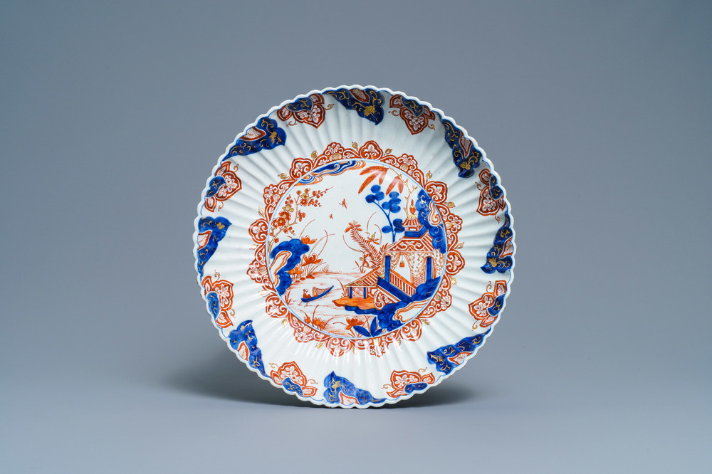 A fluted Dutch Delft dor&eacute; chinoiserie dish with a pagoda in a landscape, 1st quarter 18th C.