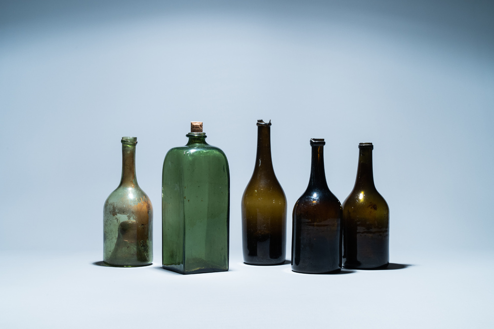 Five green glass bottles, 17/18th C.