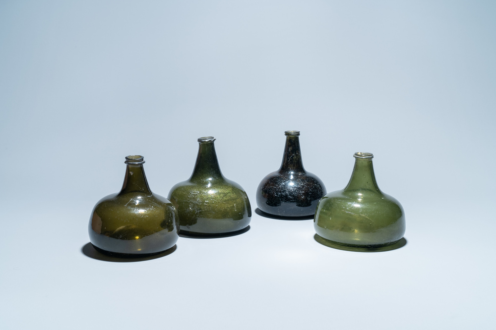 Four green glass wine bottles, 17/18th C.