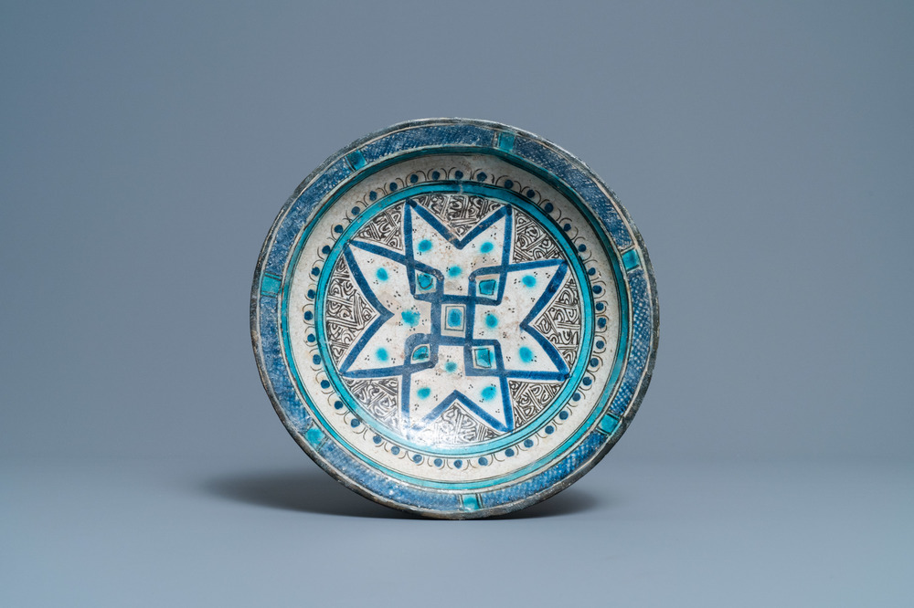 A polychrome Persian pottery dish with geometrical design, 14th C.
