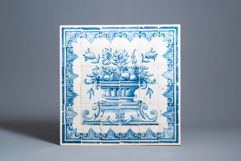 A blue and white Portuguese tile mural depicting an urn filled with flowers and fruits, 18th C.