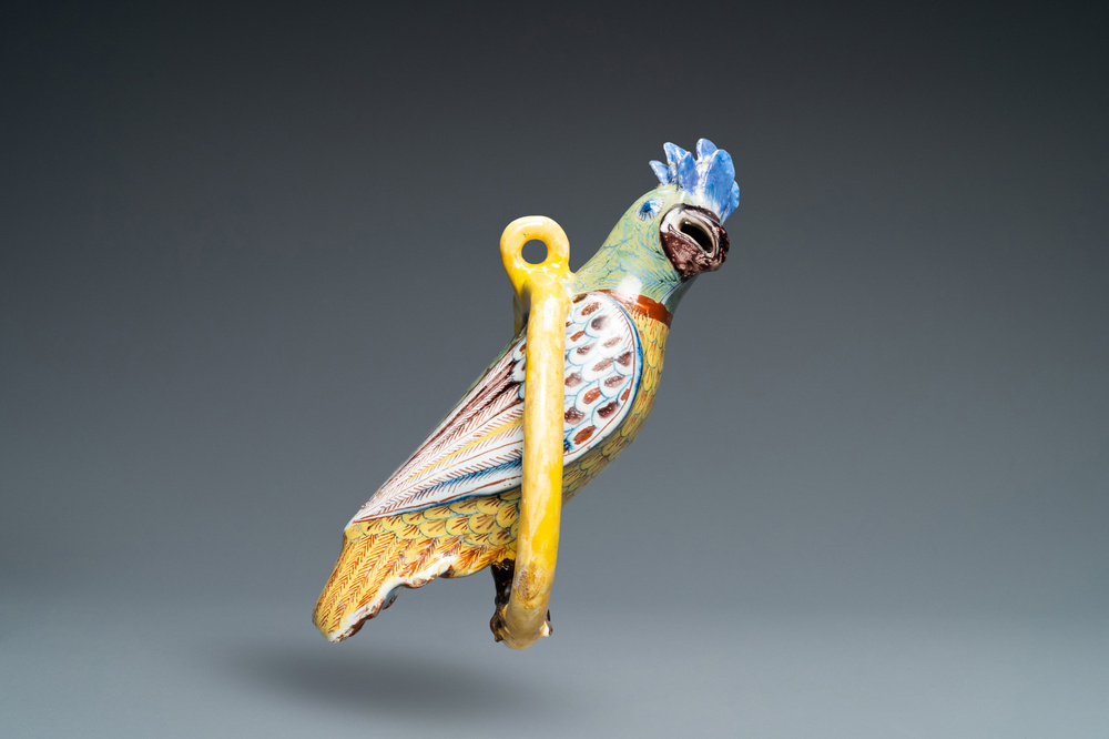 A polychrome Dutch Delft model of a parrot on a ring, 18th C.