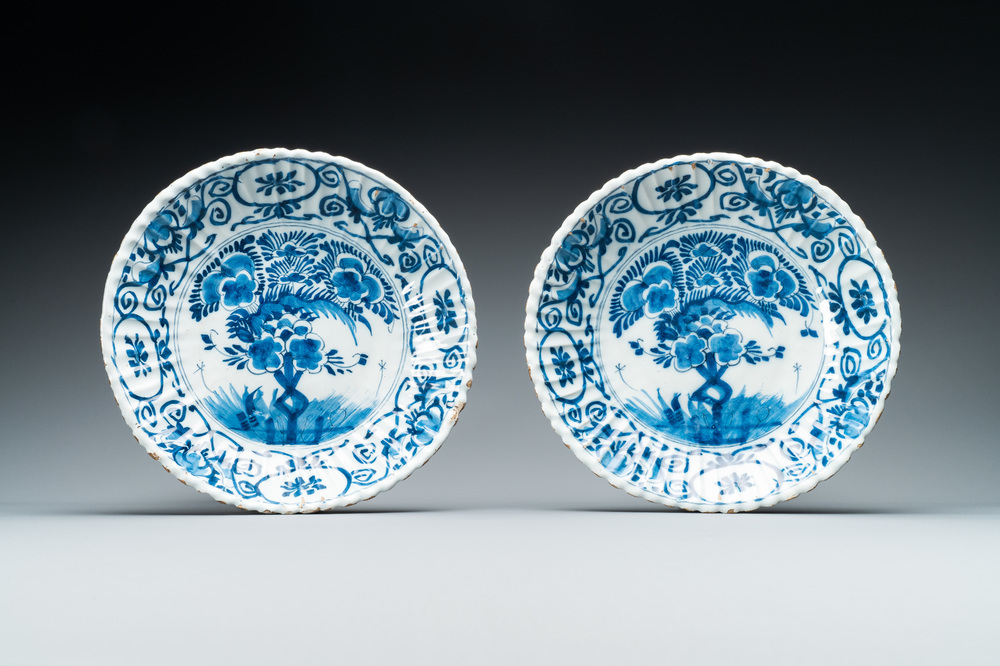 A pair of ribbed Dutch Delft blue and white 'tea tree' plates, 18th C.