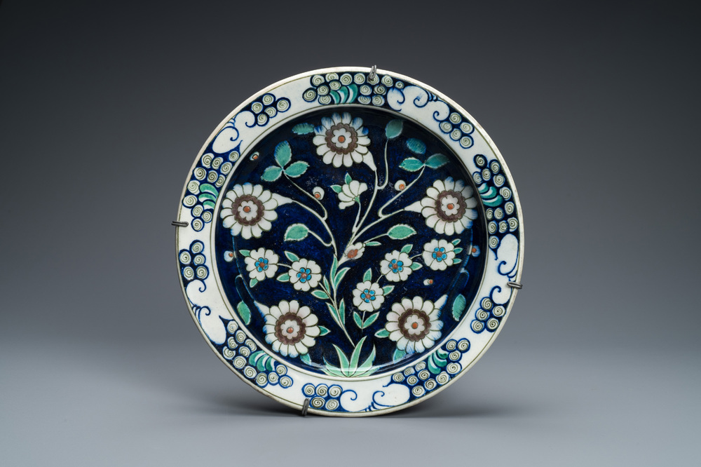A blue-ground Iznik-style pottery dish, K&uuml;tahya, Turkey, 19th C.