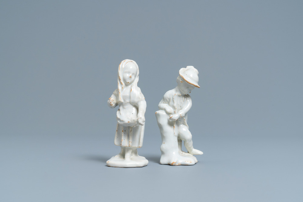 Two white Dutch Delftware figures of a boy and a girl, 18th C.