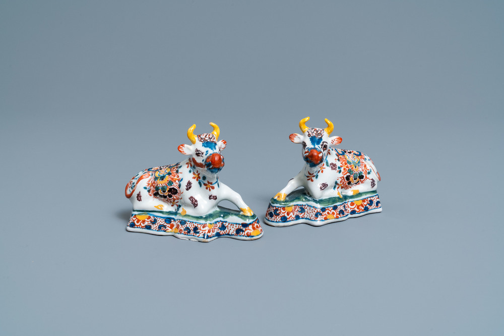 A pair of polychrome Dutch Delft models of cows, 18th C.