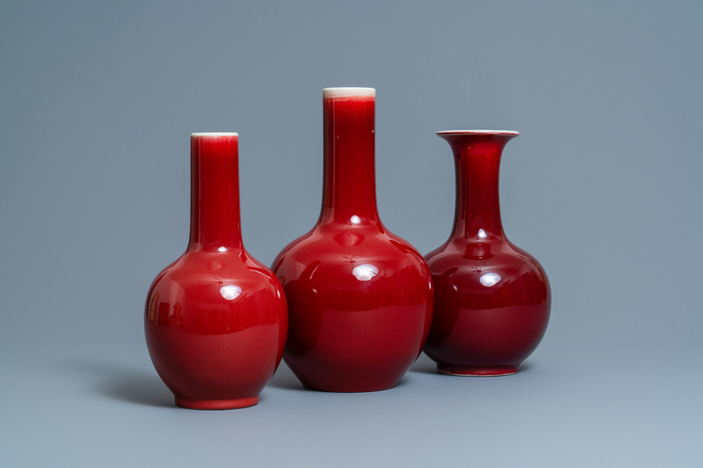 Three Chinese monochrome sang de boeuf-glazed bottle vases, 19/20th C.
