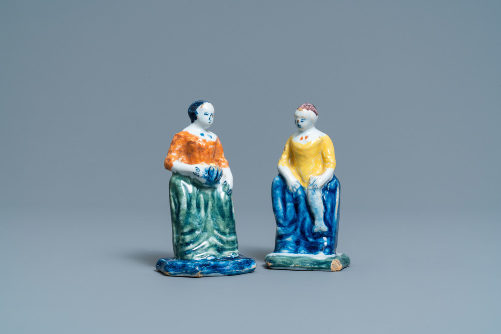 A pair of polychrome Dutch Delft figures of market ladies, 18th C.