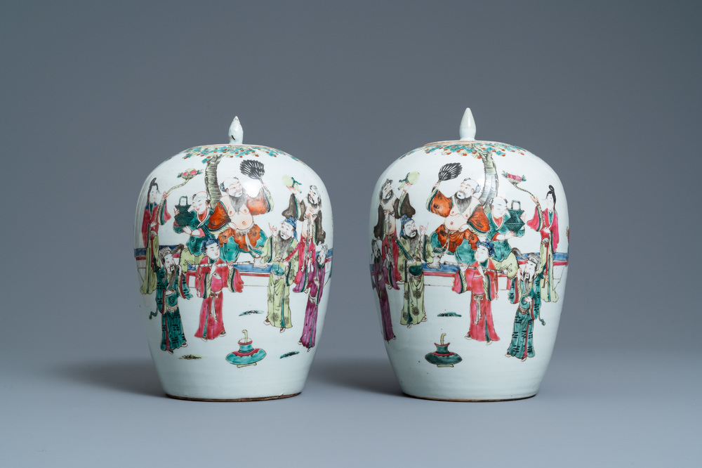 A pair of Chinese famille rose jars and covers, 19th C.