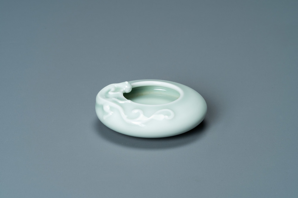 A Chinese celadon-glazed 'dragon' brush washer, Qianlong mark, 19/20th C.