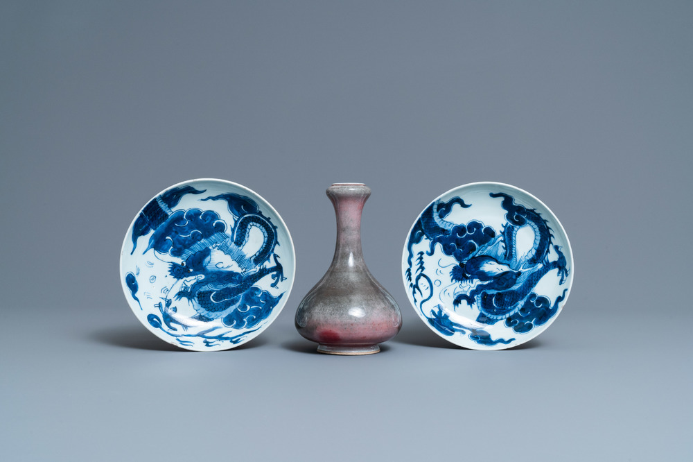 A pair of Chinese blue and white 'dragon' plates and a monochrome copper-red vase, Kangxi and later