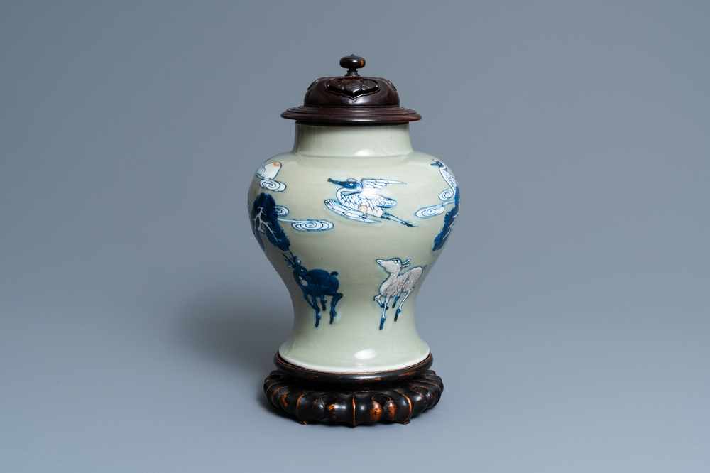 A Chinese blue, white and copper-red celadon-ground 'birds and deer' vase, Kangxi