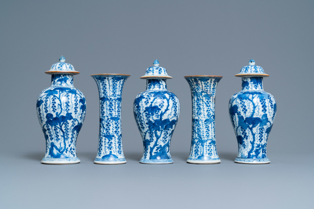 A Chinese blue and white five-piece garniture with grapevines, Kangxi