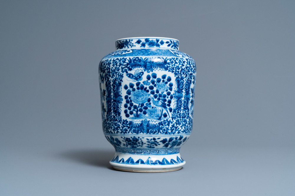 A Chinese blue and white 'birds and butterflies' vase, seal mark, 19th C.