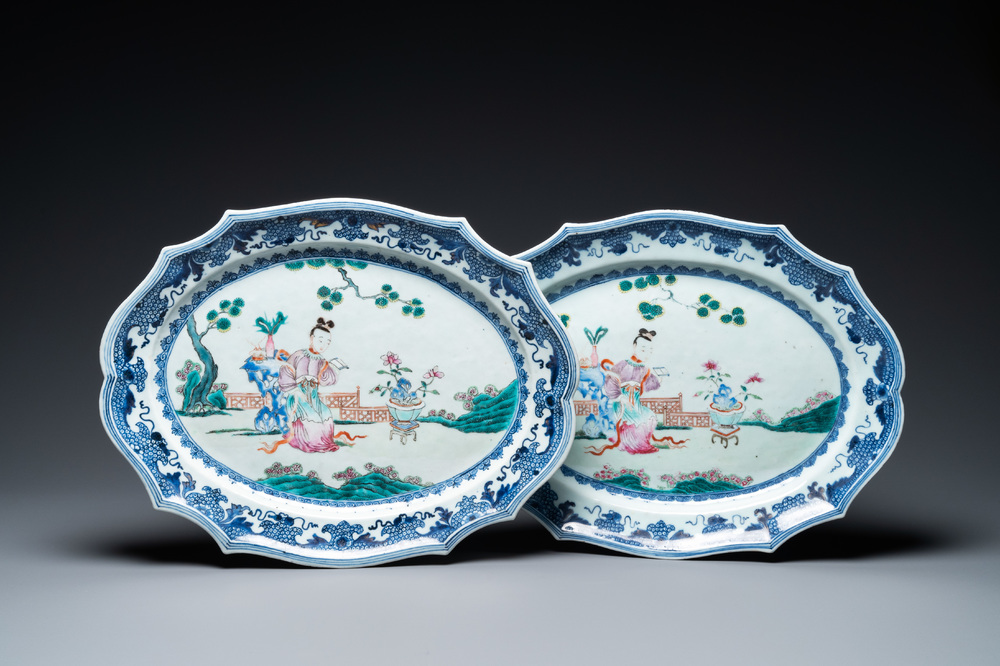 A pair of Chinese oval famille rose dishes with a lady in a garden, Qianlong
