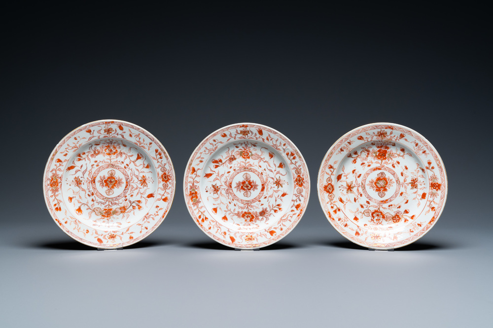 Three Chinese iron-red and gilt plates with floral design, Kangxi