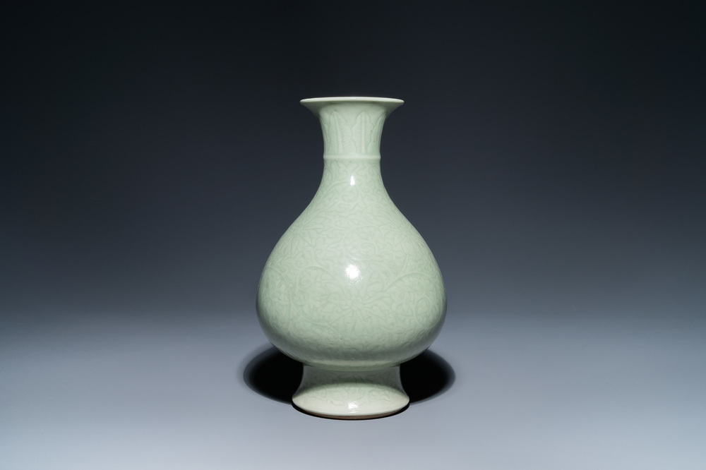 A Chinese monochrome celadon-glazed 'yuhuchunping' vase with underglaze floral design, Kangxi mark, 19th C.