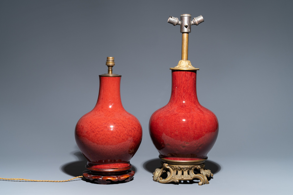 Two Chinese monochrome sang de boeuf-glazed bottle vases transformed into lamps, 19th C.