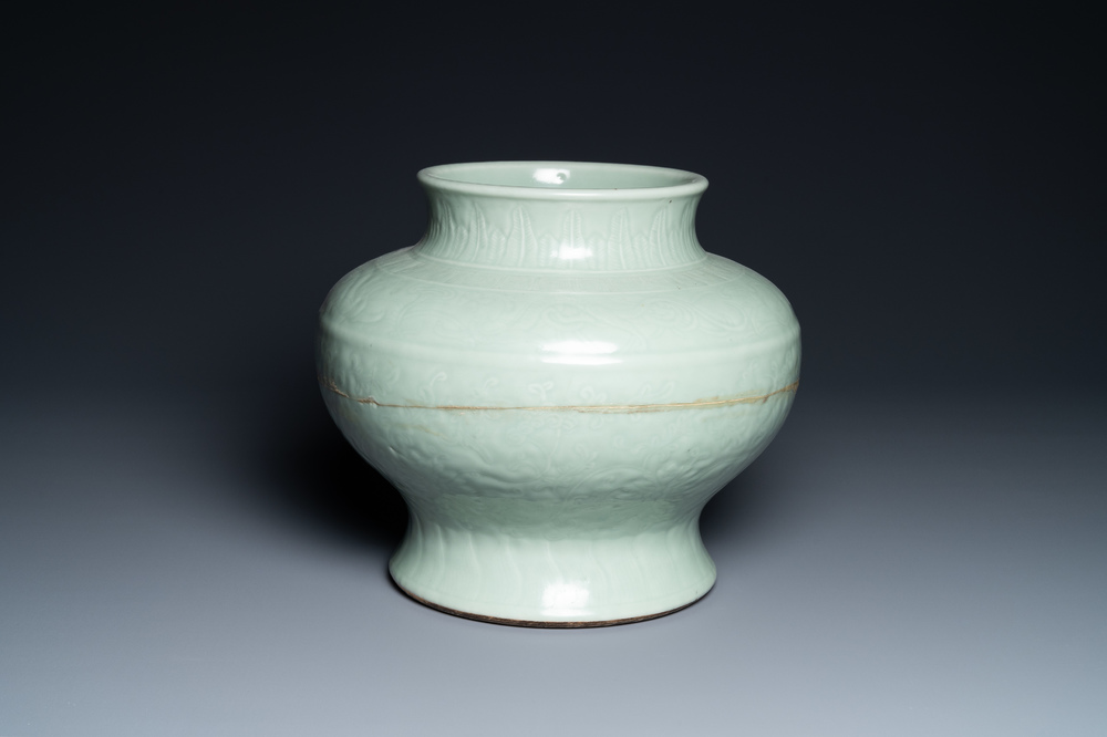 A Chinese monochrome celadon vase with underglaze floral design, Chenghua mark, Kangxi