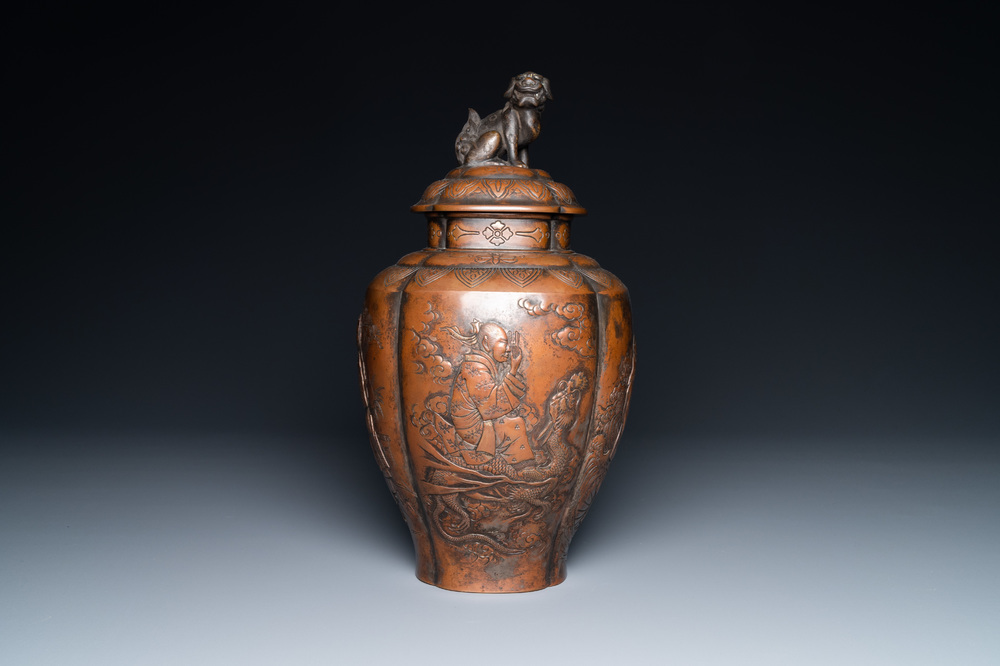 A Japanese hammered brass vase and cover, Meiji, 19th C.