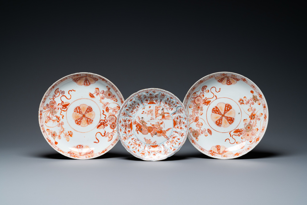 A pair of Chinese iron-red and gilt dishes and a lotus-molded plate, Kangxi