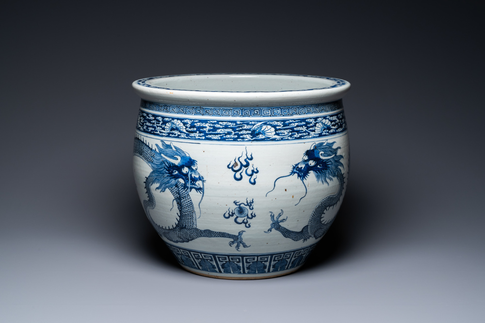 A Chinese blue and white 'dragons' fish bowl, Qianlong/Jiaqing