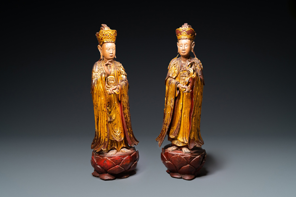 A pair of large Chinese or Vietnamese gilded, lacquered and painted wooden figures, 18/19th C.