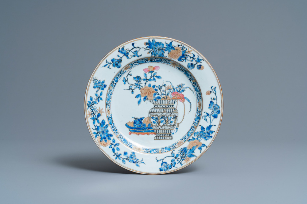 A Chinese overglaze enamel and grisaille plate with a flower basket and fruits, Yongzheng