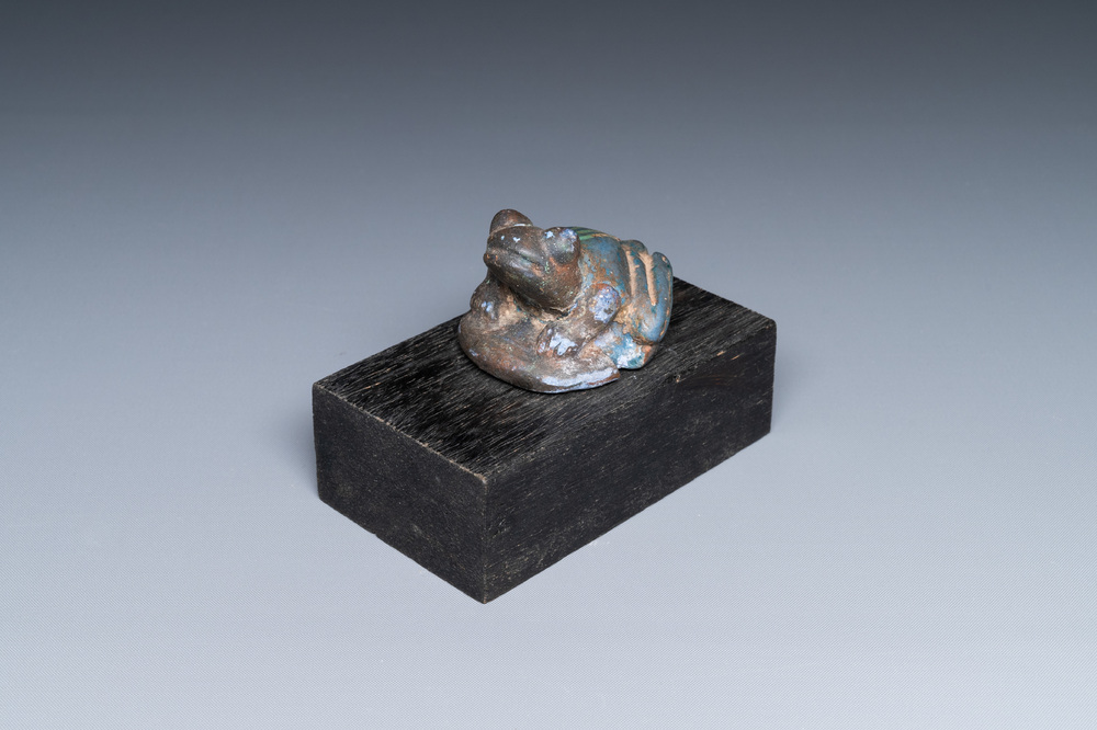 An Egyptian cobalt blue- and turquoise-glazed faience model of a frog, 15/11th C. BC