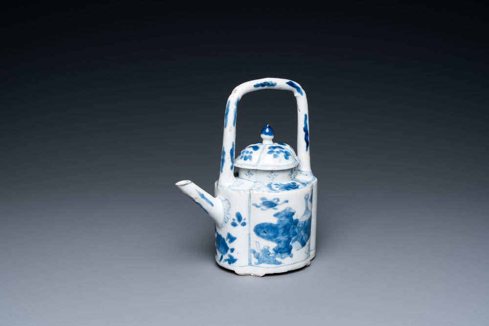 A Chinese blue and white arch-handled teapot and cover, Kangxi