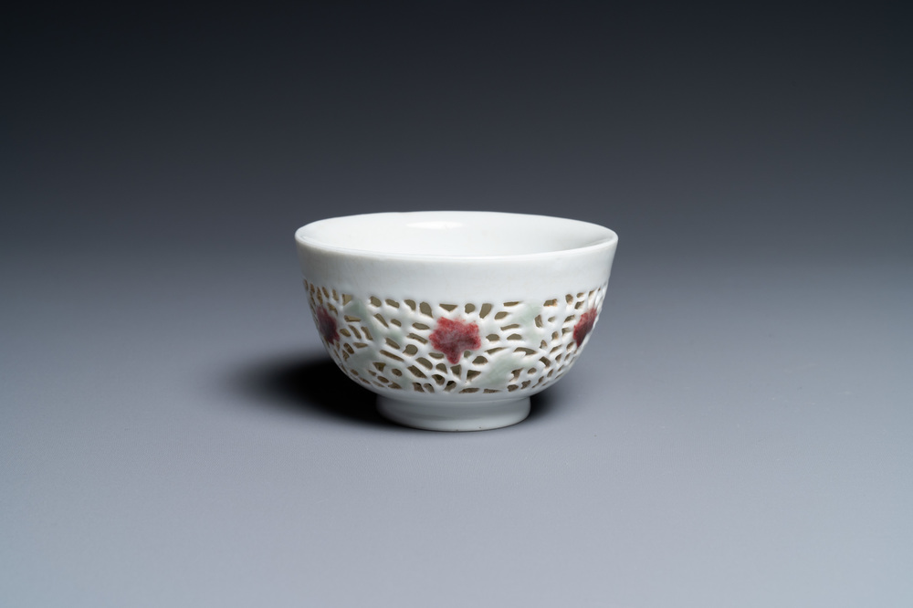 A Chinese reticulated double-walled cup with copper-red and celadon spots, Yongzheng