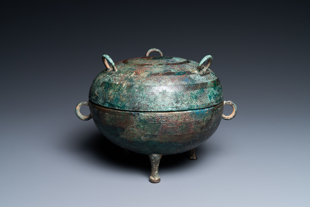 A Chinese bronze ritual tripod 'dui' food vessel and cover, Eastern Zhou