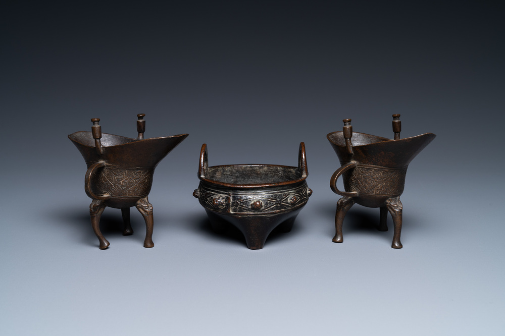 Two Chinese small bronze 'jue' ewers and a tripod censer, probably Yuan