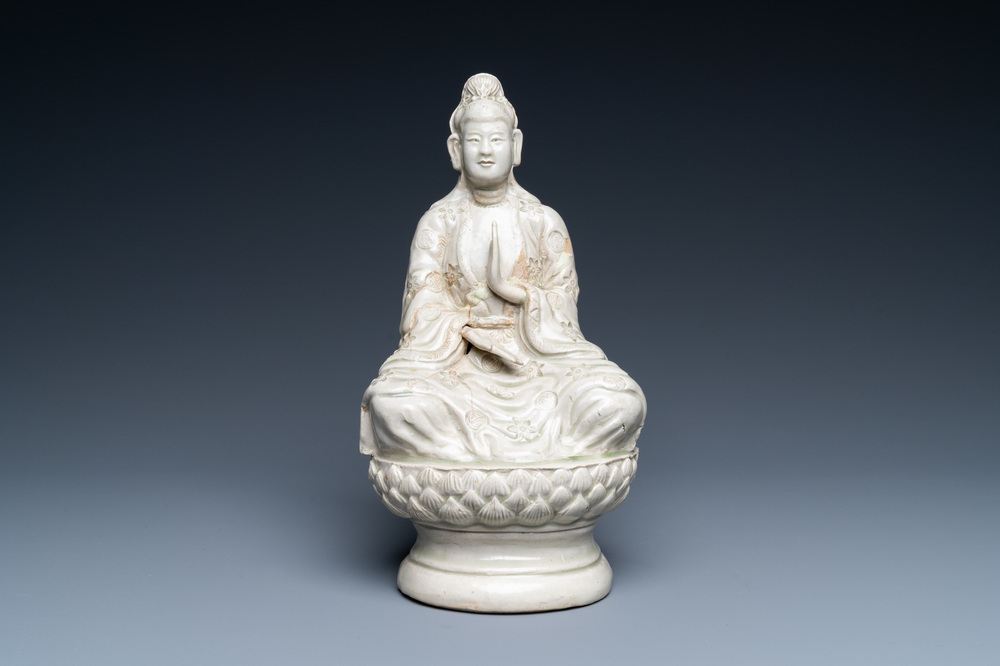 A pale celadon-glazed figure of Quan Am, North-Vietnam, 17/18th C.