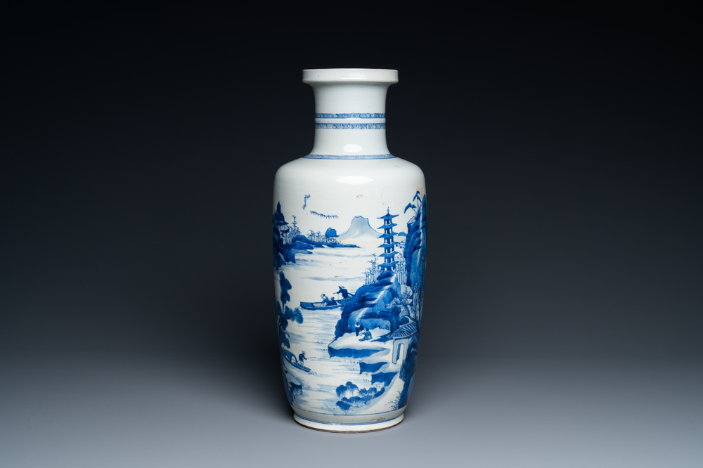 A Chinese blue and white rouleau vase with figures in a mountainous landscape, Kangxi