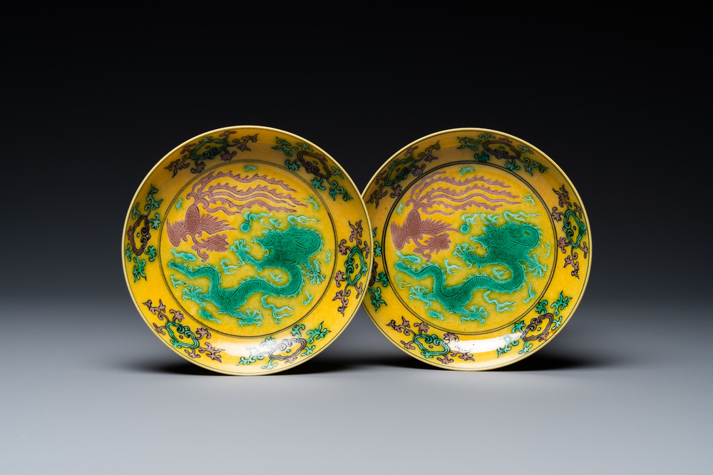 A pair of Chinese yellow-ground turquoise- and aubergine-glazed 'dragon and phoenix' plates, Qianlong mark, 19/20th C.