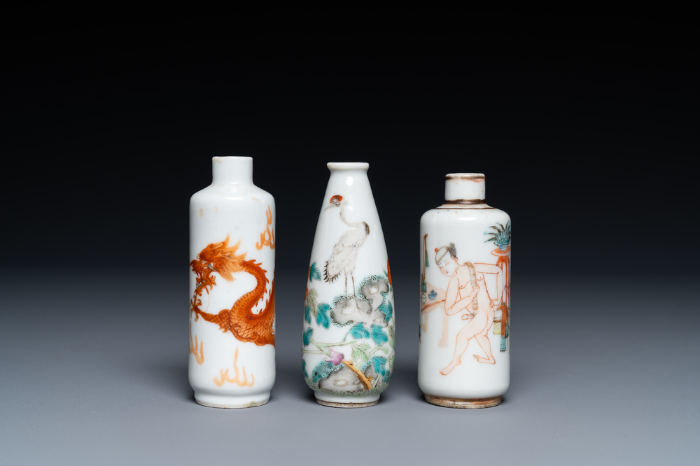 Three Chinese iron red and famille rose snuff bottles incl. one with an erotical subject, 19th C.
