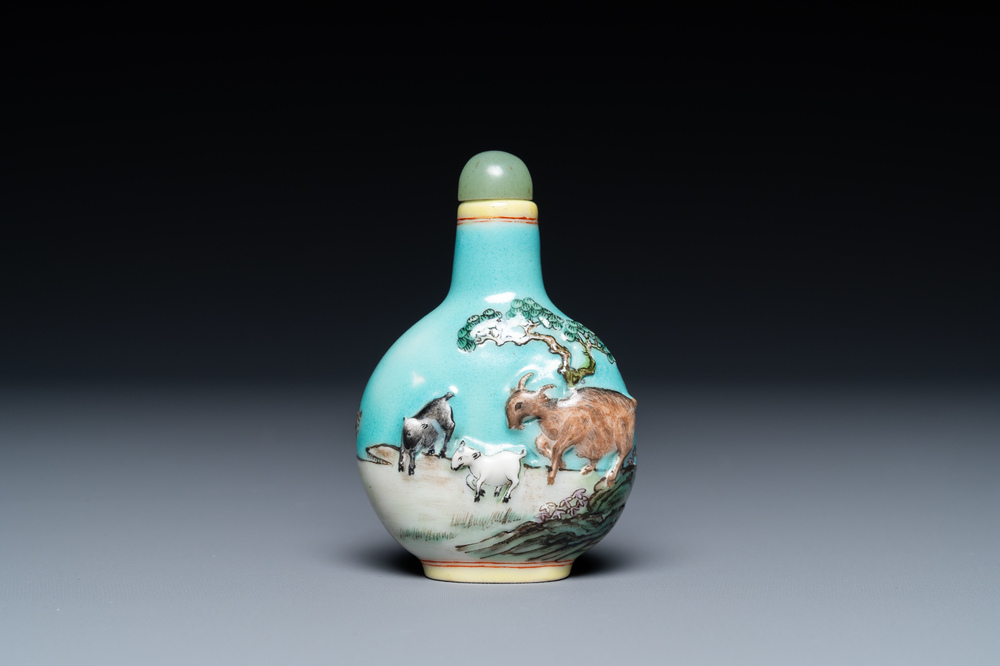 A Chinese relief-molded snuff bottle depicting goats, Yang He Tang mark, 19/20th C.