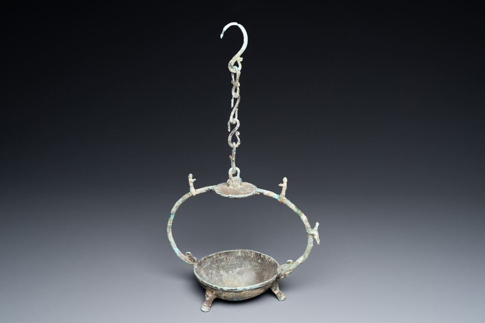 A Vietnamese bronze oil lamp with complete suspension chain, Dong Son, ca. 3rd/1st C. BC